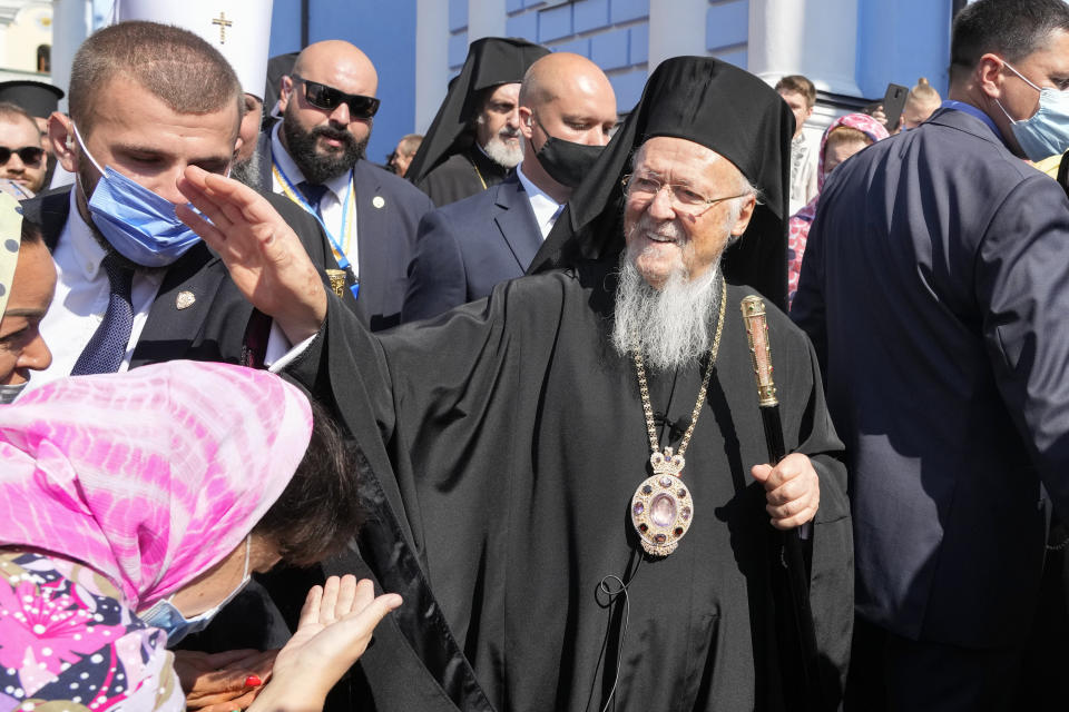 Ecumenical Patriarch Bartholomew I blesses parishioners at the Mikhailovsky Zlatoverkhy Cathedral (St. Michael's Golden-Domed Cathedral) in Kyiv, Ukraine, Saturday, Aug. 21, 2021. Bartholomew I arrived at Kyiv to mark the 30th anniversary of Ukraine's independence that is celebrated on Aug. 24. (AP Photo/Efrem Lukatsky)