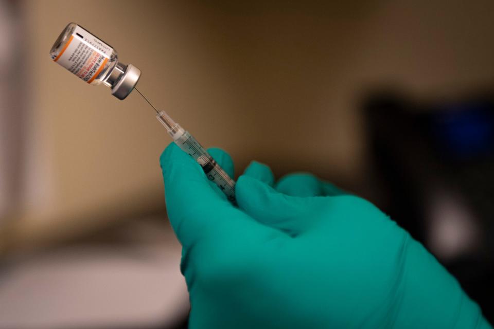 Veronica Ehlinger, nurse manager at The Youth Clinic in Fort Collins, Colorado, loads a syringe with a dose of the Pfizer vaccine on Nov. 10.