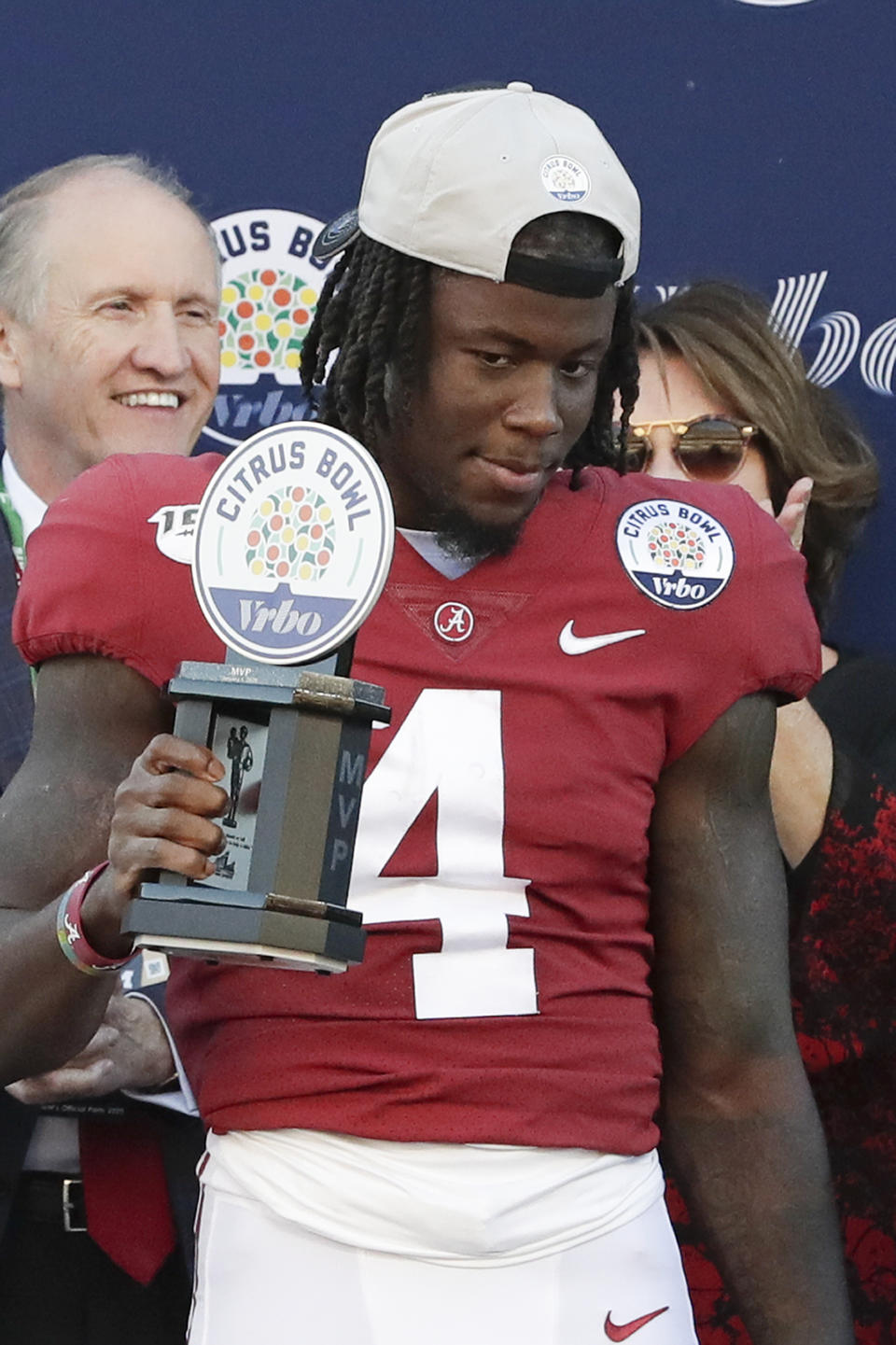 Alabama wide receiver Jerry Jeudy holds up the trophy after he was named MVP of the Citrus Bowl after defeating Michigan in an NCAA college football game, Wednesday, Jan. 1, 2020, in Orlando, Fla. (AP Photo/John Raoux)
