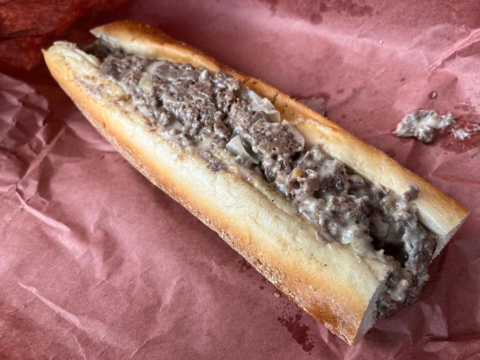 The mammoth, Cooper Sharp and ribeye cheesesteak at Philadelphia's Cafe Carmela, served on a seeded roll from Carangi bakery.