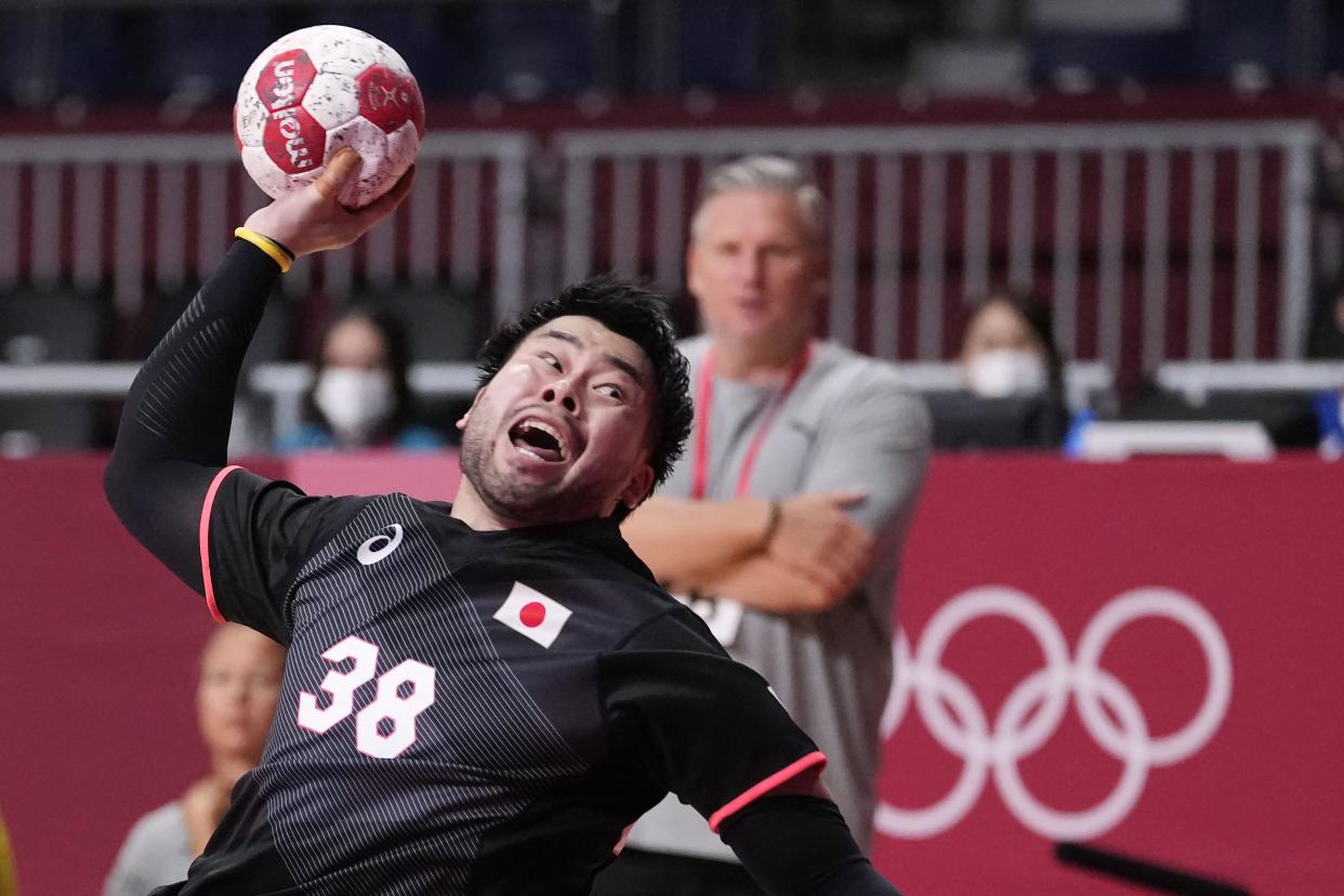 Japan's Kotaro Mizumachi tries to score during the men's Preliminary Round Group B handball match between Denmark and Japan and Egypt at the 2020 Summer Olympics, Saturday, July 24, 2021, in Tokyo, Japan.