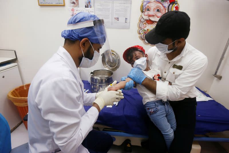 A child who suffers from cancer receives a treatment at the Children's Hospital for Cancer Diseases in Basra