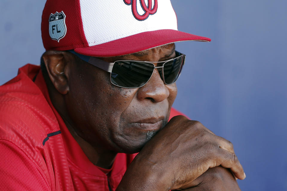 FILE - In this March 11, 2017, file photo, Washington Nationals manager Dusty Baker talks to reporters in the dugout before playing New York Mets in a spring training baseball game, in Port St. Lucie, Fla. A person with knowledge of the negotiations said Tuesday, Jan. 28,2 020, that Baker, 70, is working to finalize an agreement to become manager of the Houston Astros. The person spoke on condition of anonymity because the deal has not yet been completed. (AP Photo/John Bazemore, File)