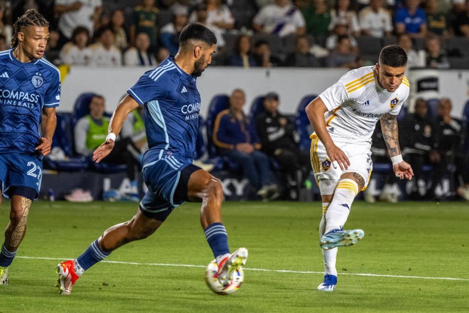 CARSON, CA - JUNE 15: Gabriel Pec #11 of Los Angeles Galaxy scores a goal as Robert Castellanos.