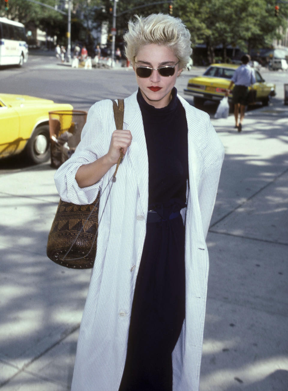 Arriving at a rehearsal for the Lincoln Center Workshop production of &ldquo;Goose and Tomtom&rdquo; in New York City, Madonna looked undeniably cool in this white seersucker overcoat&nbsp;and black ensemble.