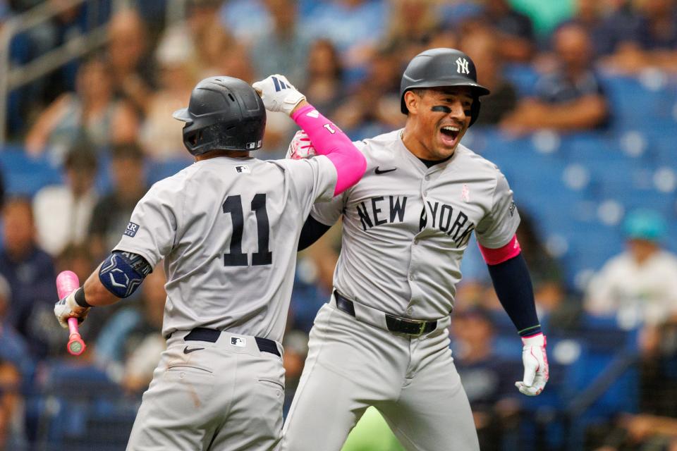 May 12, 2024; St. Petersburg, Florida, USA; New York Yankees outfielder Jahmai Jones (14) celebrates with shortstop Anthony Volpe (11) after hitting a solo home run against the Tampa Bay Rays in the third inning at Tropicana Field. Mandatory Credit: Nathan Ray Seebeck-USA TODAY Sports