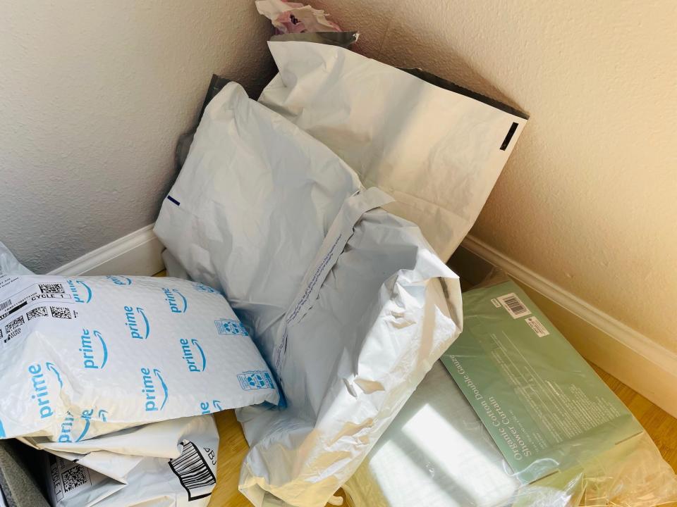 a pile of packages is seen in the corner