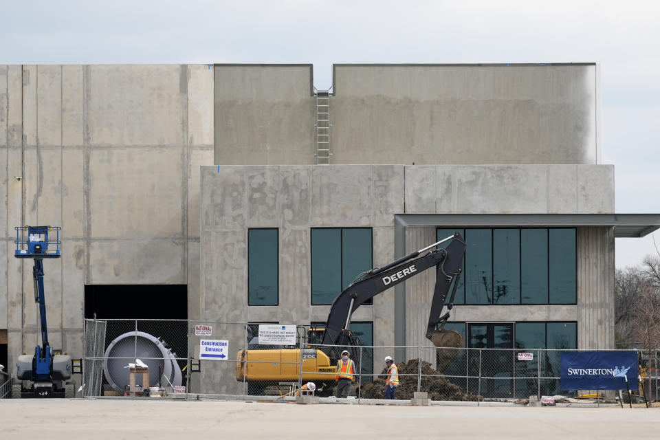 Construction continues at a building complex in Mesquite, Texas, Friday, Feb. 16, 2024. At a bustling construction site outside of Dallas, there are hopes that Congress can finally pass nearly $95 billion in foreign aid including funding for Ukraine, because factory jobs in the United States depend on that money. Aerospace and defense company General Dynamics’ new factory in the Dallas suburb of Mesquite is expected to initially employ 150 people to produce munitions. (AP Photo/Tony Gutierrez)