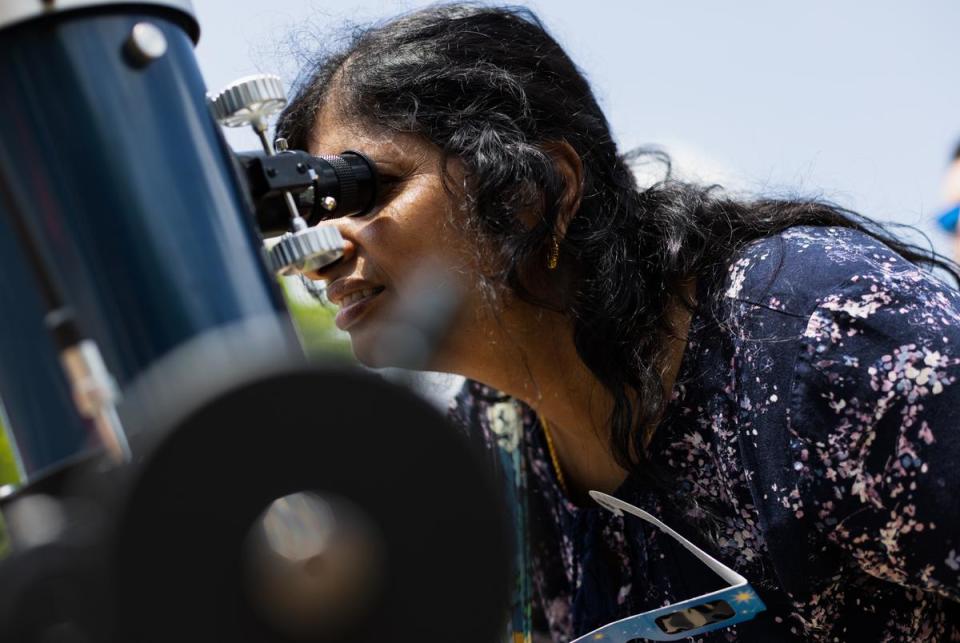Attendees look through telescopes to view the total solar eclipse on Monday, April 8, 2024 in Sulphur Springs. Cooper Lake State Park was donated these telescopes by the Texas State Park foundation.