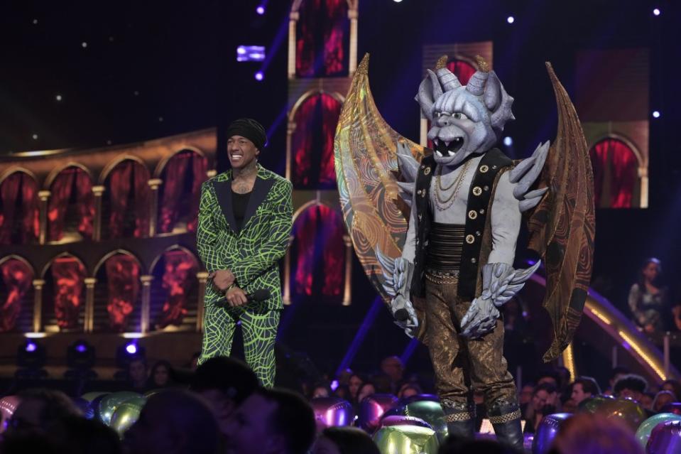 THE MASKED SINGER: L-R: Nick Cannon and Gargoyle in the “Battle of the Saved” episode of THE MASKED SINGER airing Wednesday, April 26 (8:00-9:01 PM ET/PT) on FOX. CR: Michael Becker/FOX. ©2023 FOX Media LLC.