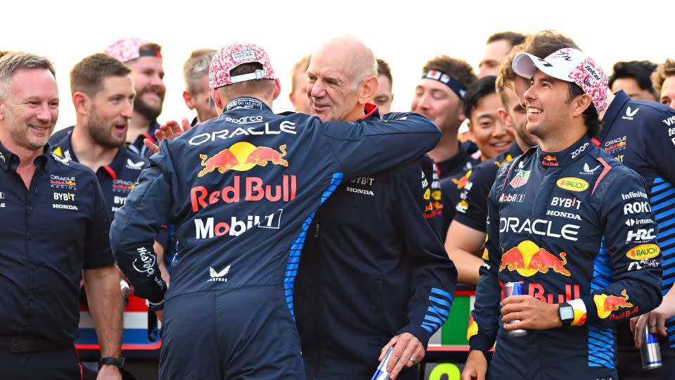 Newey (middle) is hugged by Max Verstappen after the Dutch driver won the 2024 Japanese Grand Prix. - Clive Mason/Getty Images