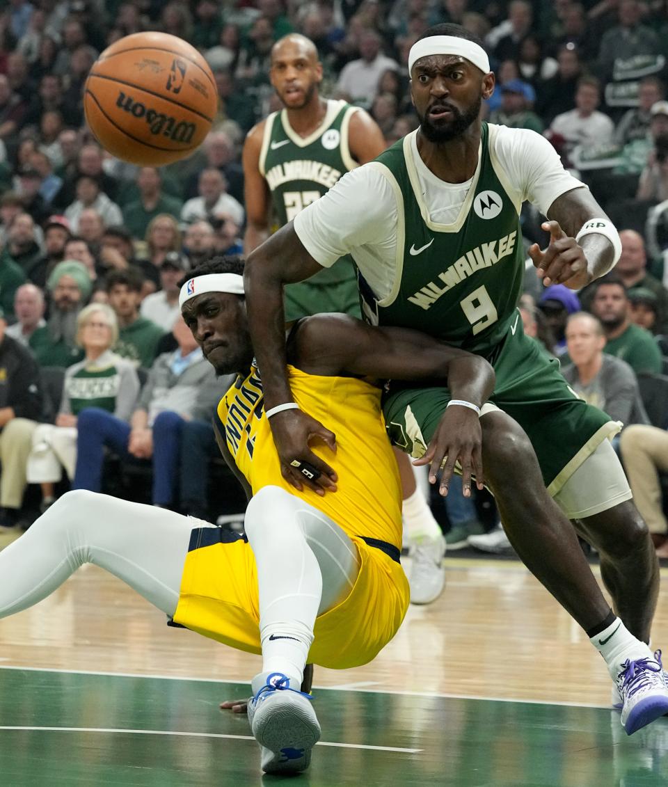 Bucks forward Bobby Portis and Pacers forward Pascal Siakam scramble for a ball during the first half of their playoff game Tuesday at Fiserv Forum