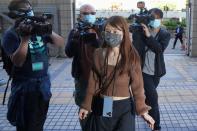 Clarisse Yeung Suet-Ying arrives at West Kowloon Magistrates' Courts building to take part in a hearing, in Hong Kong