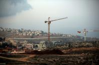 Israel's controversial wall separating the Jewish settlement of Neve Yaakov (foreground) in the northern area of east Jerusalem and the Palestinian neighborhood of al-Ram (background) in the West Bank