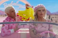 <p>Robbie and Gosling are seen driving in Barbie's pink convertible car as they leave Barbieland together. </p>