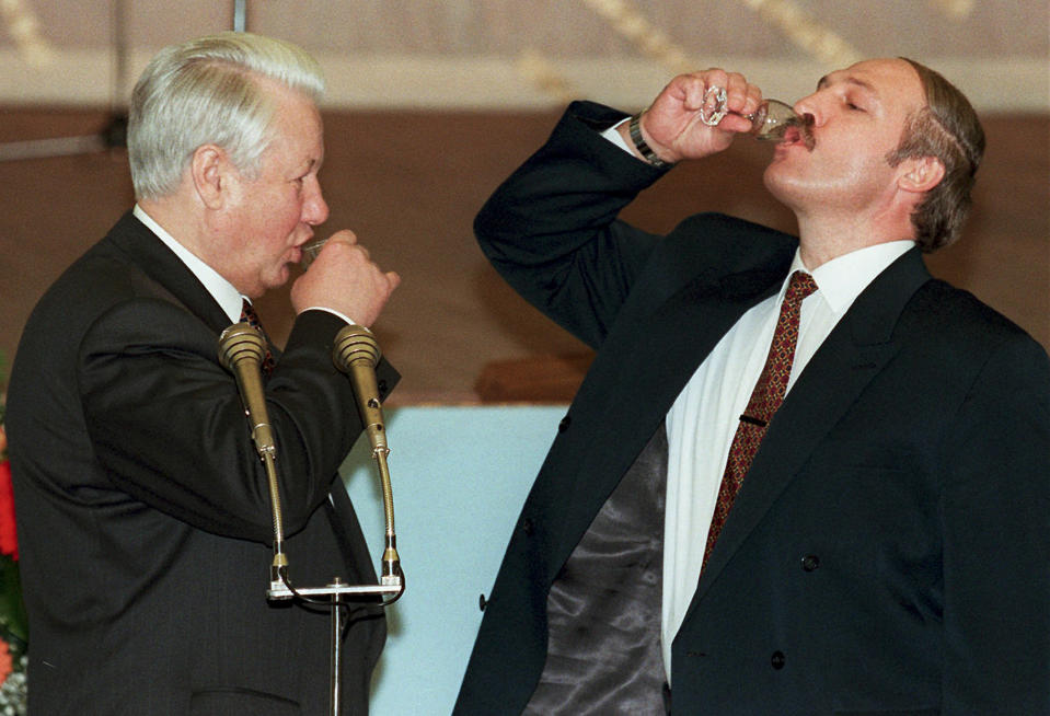 FILE In this file photo taken on Tuesday, April 2, 1996, Russian President Boris Yeltsin, left, and Belarussian President Alexander Lukashenko drink vodka after a toast celebrating the signing of an agreement in the Kremlin in Moscow, Russia. Lukashenko faces a perfect storm as he seeks a sixth term in the election held Sunday, Aug. 9, 2020 after 26 years in office. Mounting public discontent over the worsening economy and his government’s bungled handling of the coronavirus pandemic has fueled the largest opposition rallies since the Soviet collapse. (Pool Photo via AP, File)