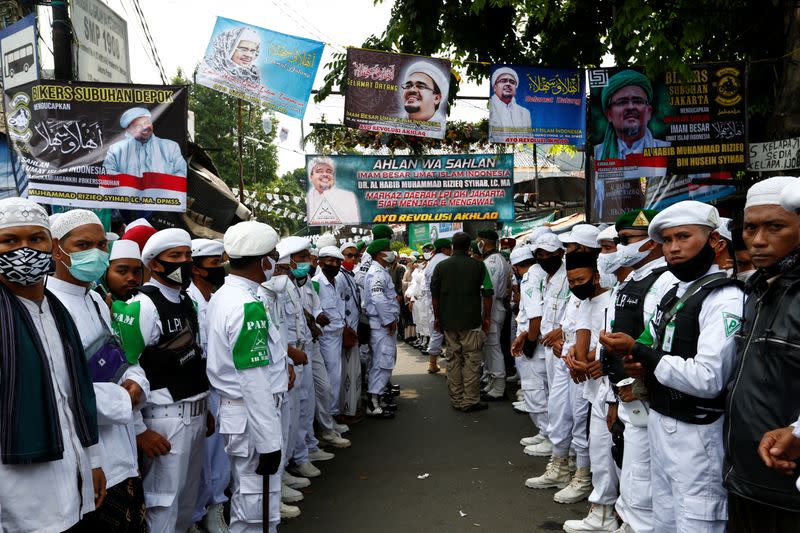 FILE PHOTO: People gather for the homecoming of Rizieq Shihab, the leader of Indonesian Islamic Defenders Front (FPI) who has resided in Saudi Arabia since 2017