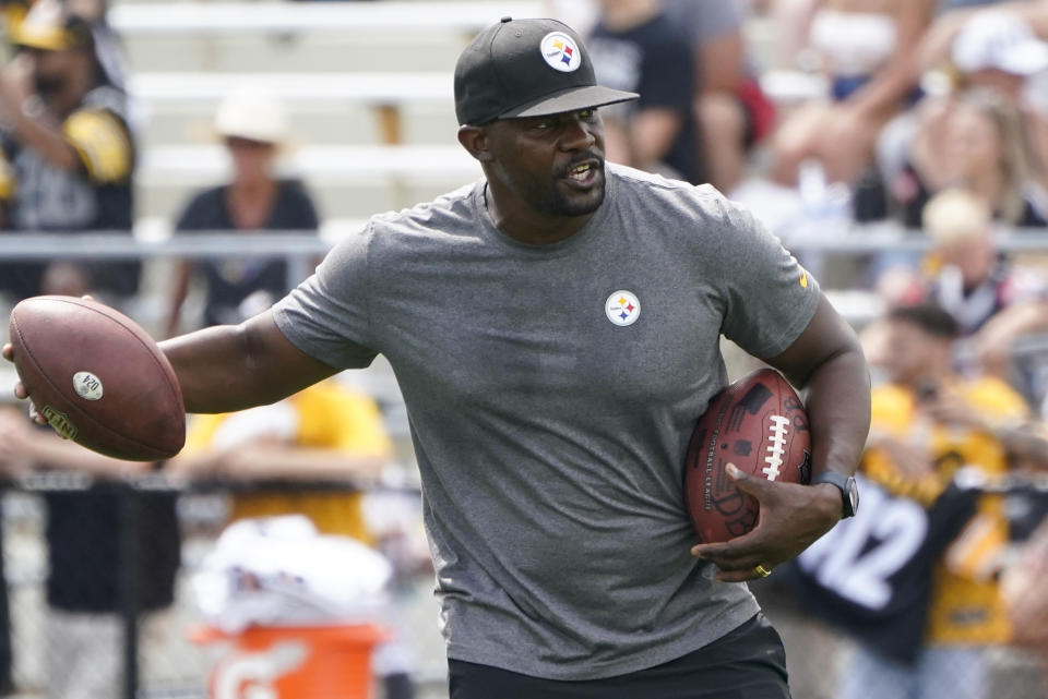 FILE - Pittsburgh Steelers senior defensive assistant Brian Flores works with the defense as they go through drills during practice at NFL football training camp in Latrobe, Pa., on Aug. 8, 2022. Flores will make his return to South Florida Sunday night, Oct. 23, 2022, when the Steelers face the Miami Dolphins. Flores was fired by the Dolphins in January and later filed a lawsuit against the NFL, the Dolphins and two other teams. (AP Photo/Keith Srakocic, File)