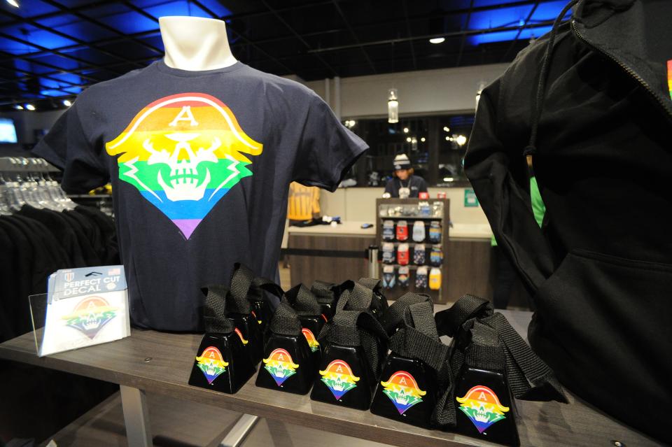 T-shirts, cowbells and decals are among the themed items on display Tuesday at the UW-Milwaukee Panther Arena team store on Milwaukee Admirals Pride Night.