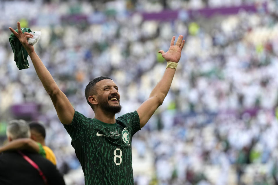 FILE - Saudi Arabia's Abdulelha Al-Malki celebrates at the end of the World Cup group C soccer match between Argentina and Saudi Arabia at the Lusail Stadium in Lusail, Qatar, on Nov. 22, 2022. Saudi Arabia won 2-1. For a brief moment after Saudi Arabia's Salem Aldawsari fired a soccer ball from just inside the penalty box into the back of the net to seal a win against Argentina, Arabs across the divided Middle East found something to celebrate. (AP Photo/Ricardo Mazalan, File)