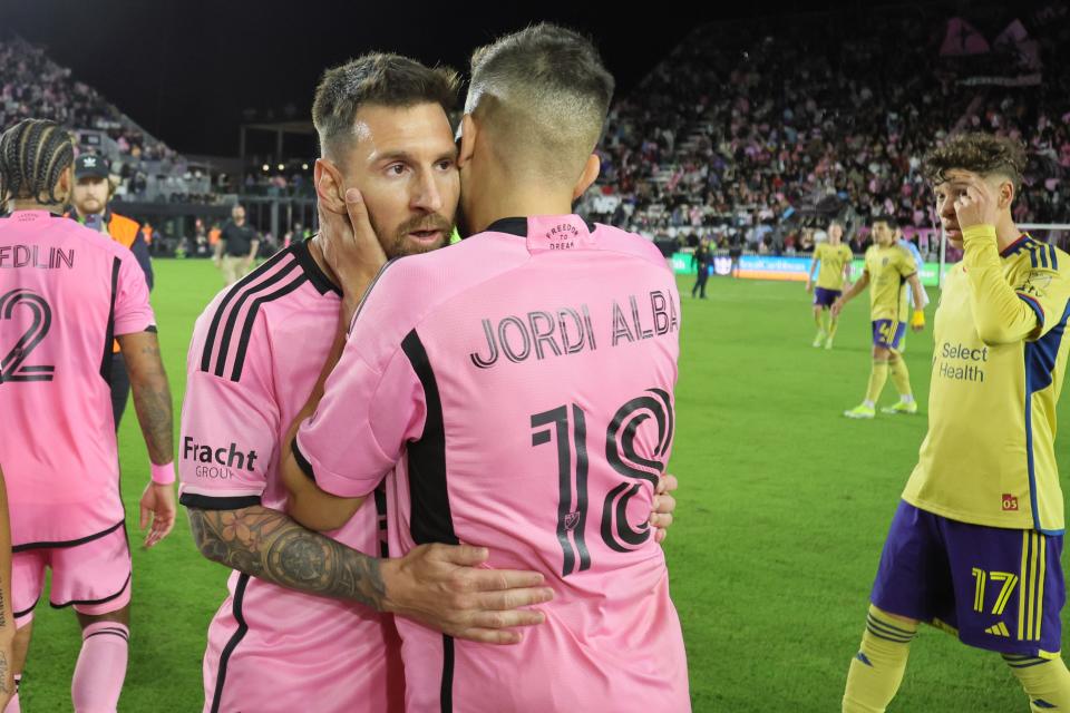 Lionel Messi and teammate Jordi Alba embrace following Inter Miami's 2-0 win over Real Salt Lake.