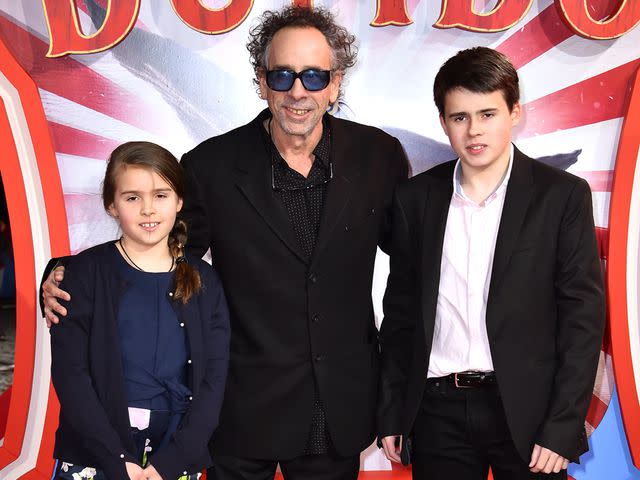 <p>Matt Crossick/PA Images/Getty </p> Tim Burton and his children, Billy Raymond Burton and Nell Burton, attend the European premiere of 'Dumbo'.