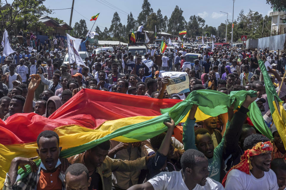 FILE - In this Saturday, May 22, 2021 file photo, supporters attend an election rally of the Ethiopian Citizens for Social Justice (EZEMA) opposition party, also attended by party leader Berhanu Nega, at Agena town in the Southern Nations, Nationalities, and Peoples' Region of Ethiopia. The country is due to vote in a general election on Monday, June, 21, 2021. (AP Photo/Mulugeta Ayene, File)