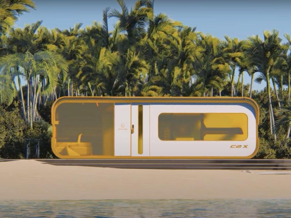 a rendering of the Cube Two X tiny home on a beach