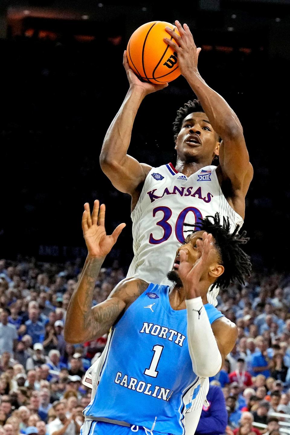 Kansas wing player Ochai Agbaji fills a need for perimeter shooting and defense for the Cavaliers, who selected Agbaji with the 14th pick in the first round of the NBA Draft on Thursday night.