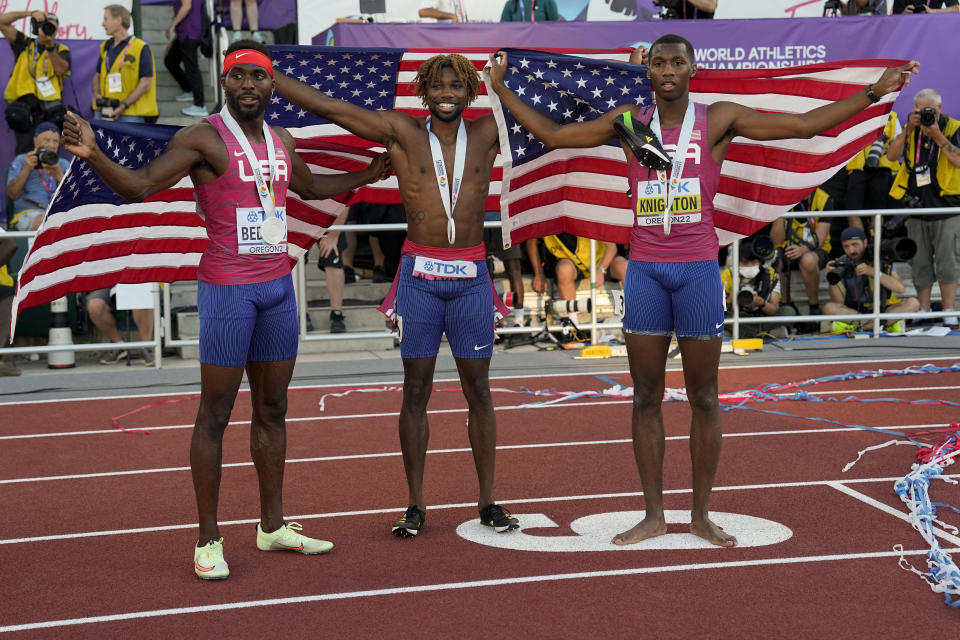 Gold medalist Noah Lyles, of the United States, silver medalist Kenneth Bednarek, of the United States, left, and bronze medalist Erriyon Knighton, of the United States, celebrate after the men's 200-meter run final at the World Athletics Championships on Thursday, July 21, 2022, in Eugene, Ore. (AP Photo/David J. Phillip)