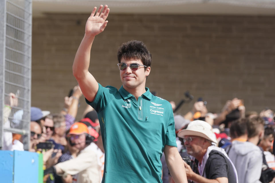 FILE - Aston Martin driver Lance Stroll, of Canada, is introduced before the Formula One U.S. Grand Prix auto race at the Circuit of the Americas, on Oct. 23, 2022, in Austin, Texas. Stroll is set to drive for Aston Martin at the Bahrain Grand Prix this week after missing preseason testing due to a wrist injury. (AP Photo/Darron Cummings, File)