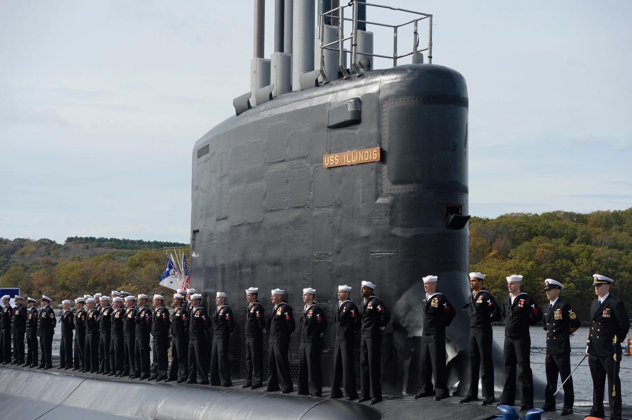 Sailors stand atop the USS Illinois in harbour at Groton, CT: AP