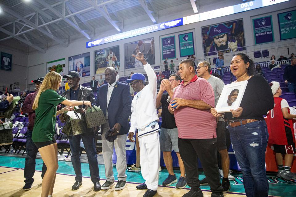 Members and family of the of the 1973 Immokalee High School basketball team were on hand to present the championship trophy to Montverde after the City of Palms tournament at Suncoast Credit Union Arena on Saturday, Dec. 23, 2023. Immokalee was the first winning team of the tournament.