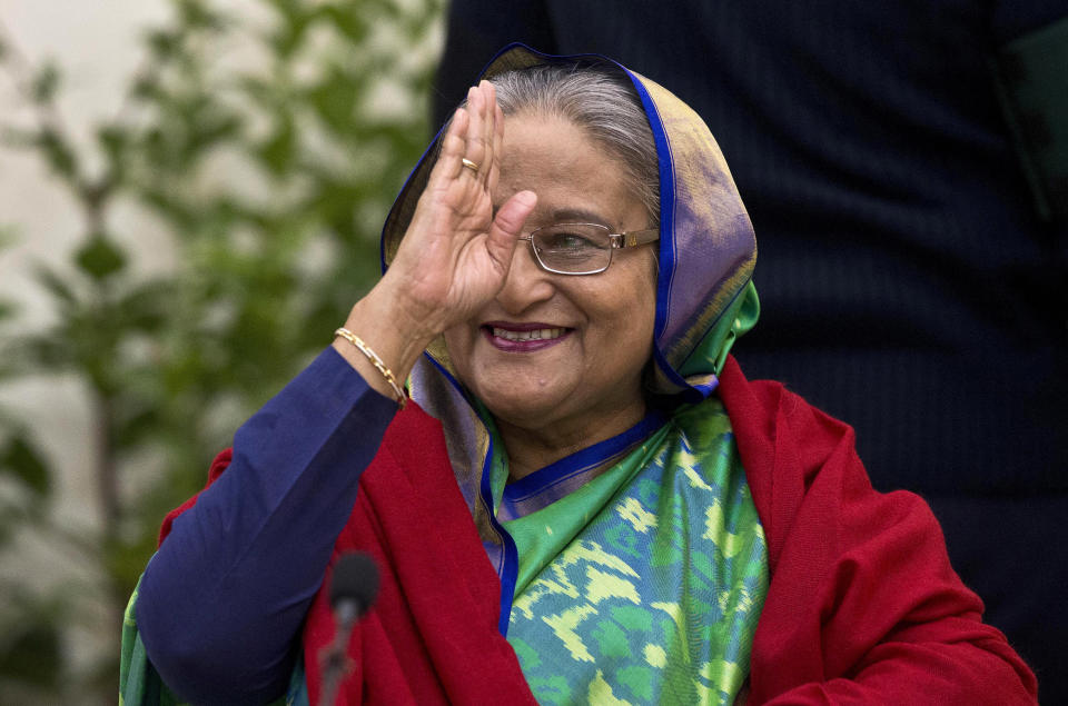 FILE- Bangladeshi Prime Minister Sheikh Hasina greets the gathering during an interaction with journalists after official election results gave her a third straight term, in Dhaka, Bangladesh, Dec. 31, 2018. The elections in Bangladesh are all about one person: Prime Minister Sheikh Hasina. Analysts predict that since the main opposition party is staying out of the Jan. 7 vote, the 76-year-old leader is practically guaranteed her fifth term in office. (AP Photo/Anupam Nath, File)
