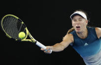 Tennis - Australian Open - Third Round - Melbourne Park, Melbourne, Australia, January 18, 2019. Denmark's Caroline Wozniacki in action during the match against Russia's Maria Sharapova. REUTERS/Aly Song