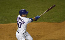 Chicago Cubs' Willson Contreras hits a one-run single against the Minnesota Twins during the first inning of a baseball game, Friday, Sept. 18, 2020, in Chicago. (AP Photo/David Banks)