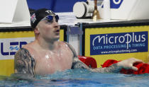 Britain's Adam Peaty celebrates after winning the men's 50 meters breaststroke finals at the European Aquatics Championships in Duna Arena in Budapest, Hungary, Saturday, May 22, 2021. (AP Photo/Petr David Josek)