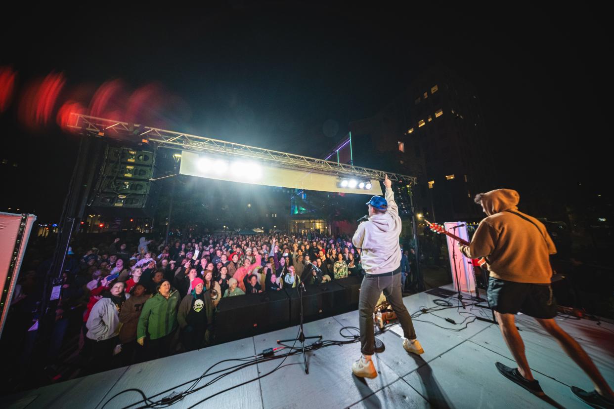 Attendees enjoy a live music performance at the 2023 Light the Night Market