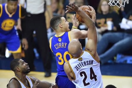 Golden State Warriors guard Stephen Curry (30) attempts to shoot the ball as Cleveland Cavaliers forward Richard Jefferson (24) defends during the fourth quarter in game six of the NBA Finals at Quicken Loans Arena. Mandatory Credit: Ken Blaze-USA TODAY Sports