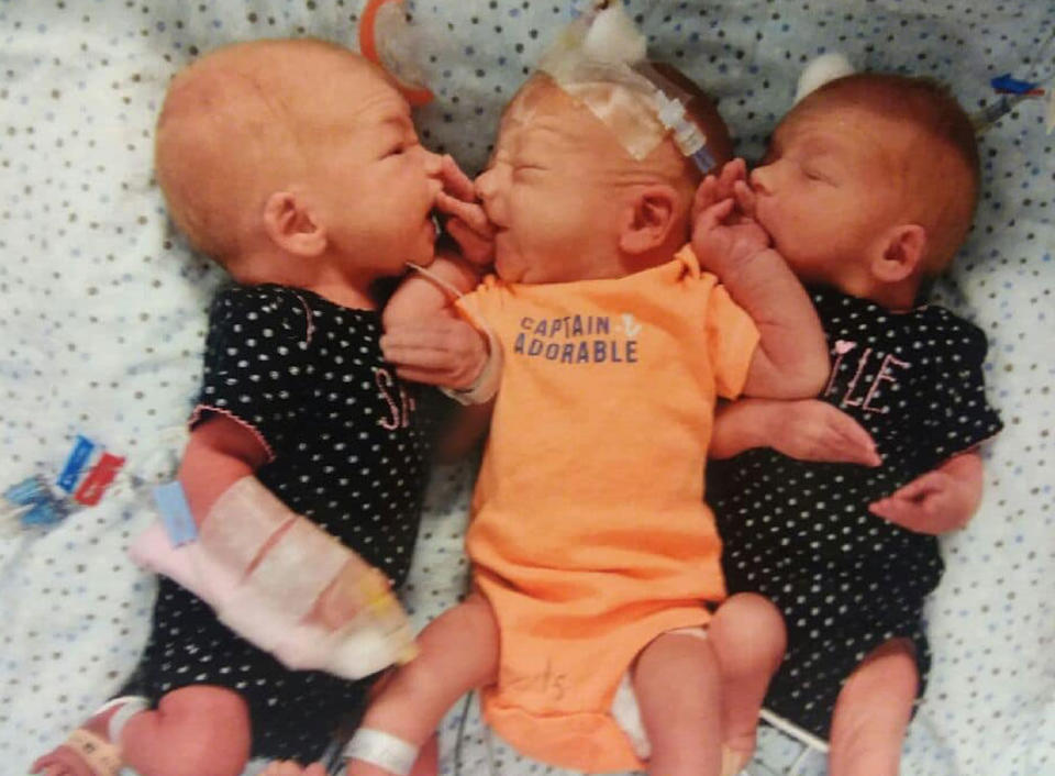 Triplet babies Blaze, Gypsy and Nikki are pictured. Dannette Giltz, their mum, thought she had kidney stones. It turns out she was 34 weeks pregnant with them.