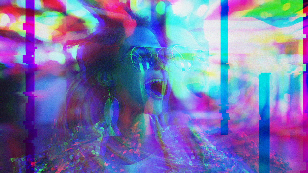 A young mom in large earrings and aviator glasses is pictured in a psychedelic swirl of color, suggesting a psilocybin experience.