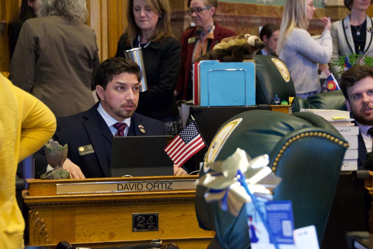 Rep. David Ortiz works on the Colorado Capitol floor on April 9.