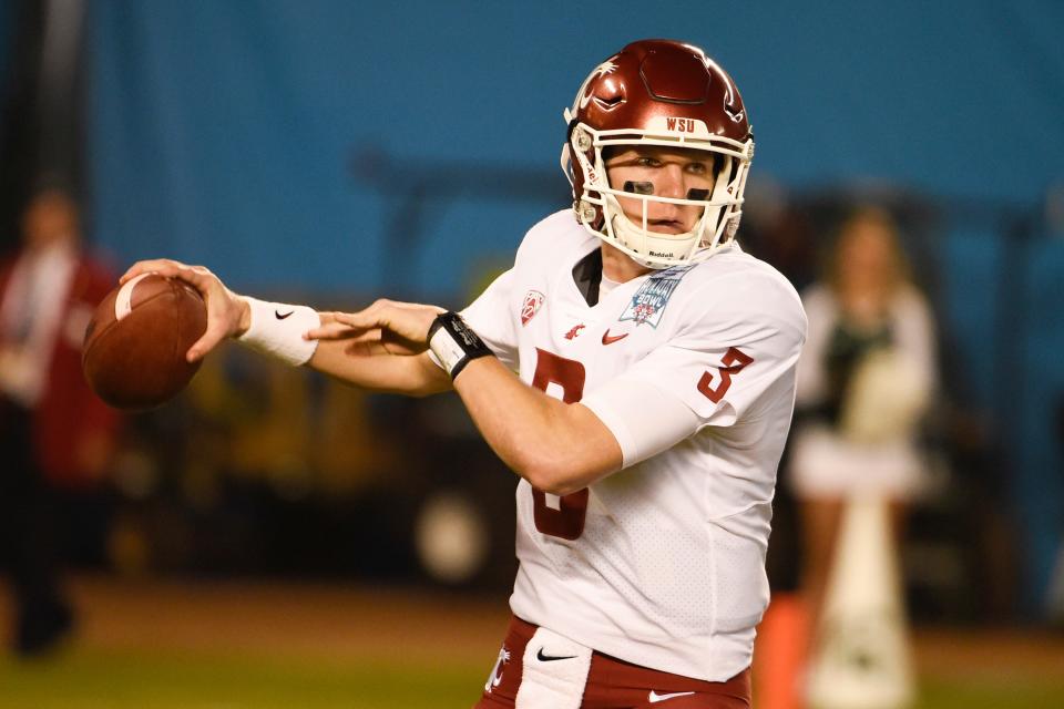 Washington State quarterback Tyler Hilinski throws during the Holiday Bowl game against Michigan State on Dec. 28, 2017, in San Diego. The family of Hilinski, who died by suicide in January 2018, said the 21-year-old quarterback had extensive brain damage that's been linked to concussions from playing the sport. Hilinski was found dead in his apartment with a gunshot wound and a suicide note on Jan. 16, 2018. (AP Photo/Denis Poroy,File)