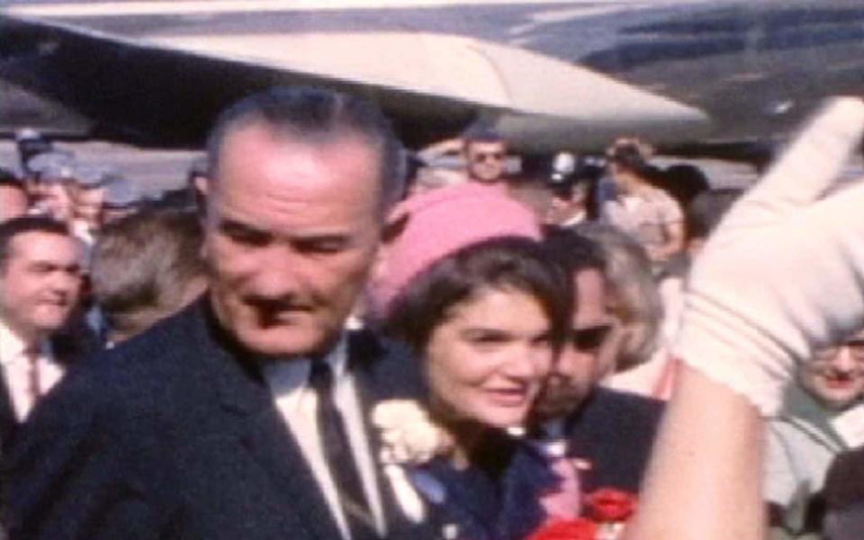 Vice President Lyndon B. Johnson and First Lady Jackie Kennedy arriving in Dallas on the day President John F. Kennedy was assassinated. - AP