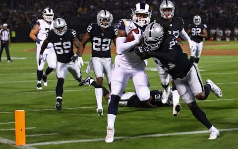 LA Rams running back Todd Gurley scores a touchdown against the Raiders - Credit: AP