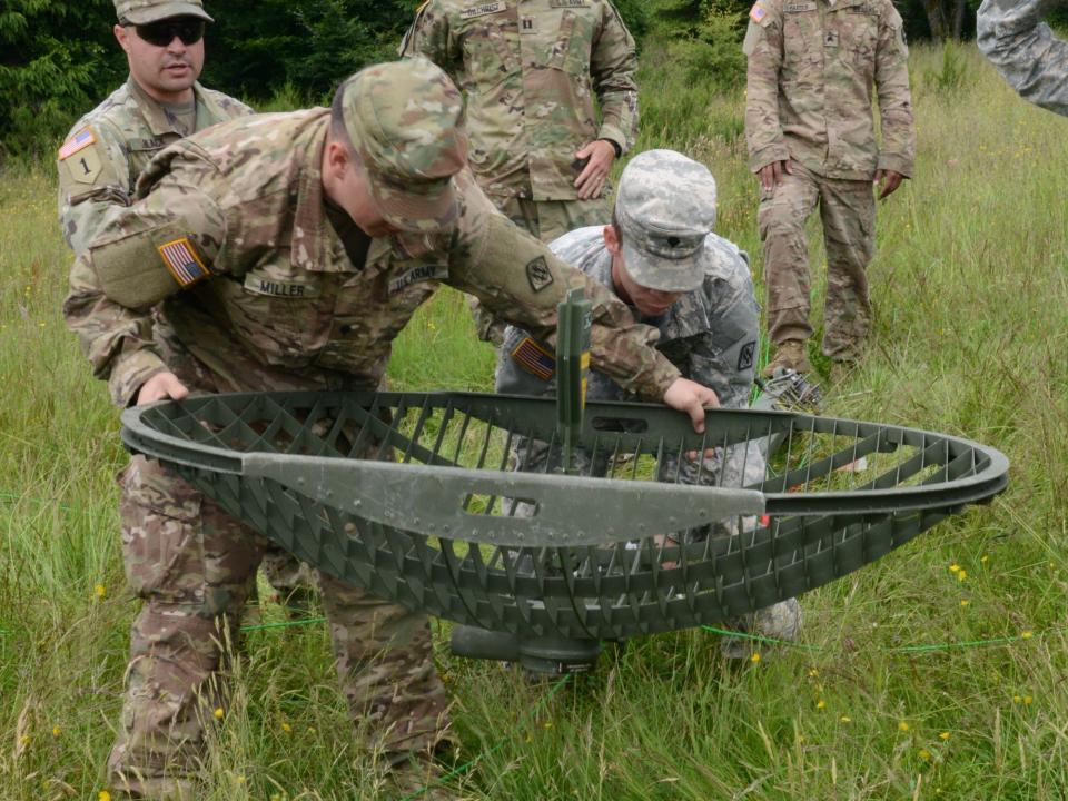 Army soldiers microwave satellite dish
