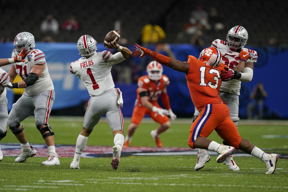 Ohio State quarterback Justin Fields throws for a touchdown against Clemson during the second half of the Sugar Bowl NCAA college football game Friday, Jan. 1, 2021, in New Orleans. (AP Photo/Gerald Herbert)