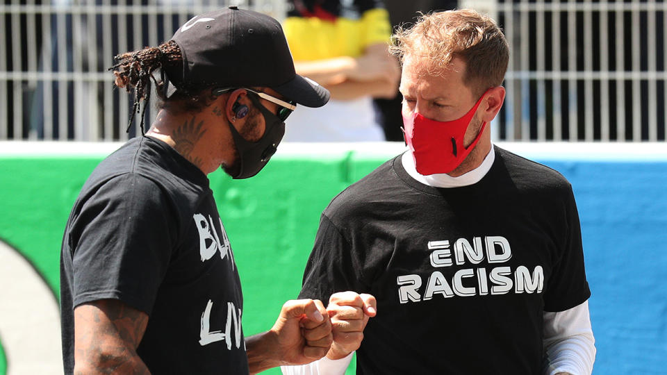 Lewis Hamilton and Sebastian Vettel are pictured fist-bumping prior to the Spanish Grand Prix.