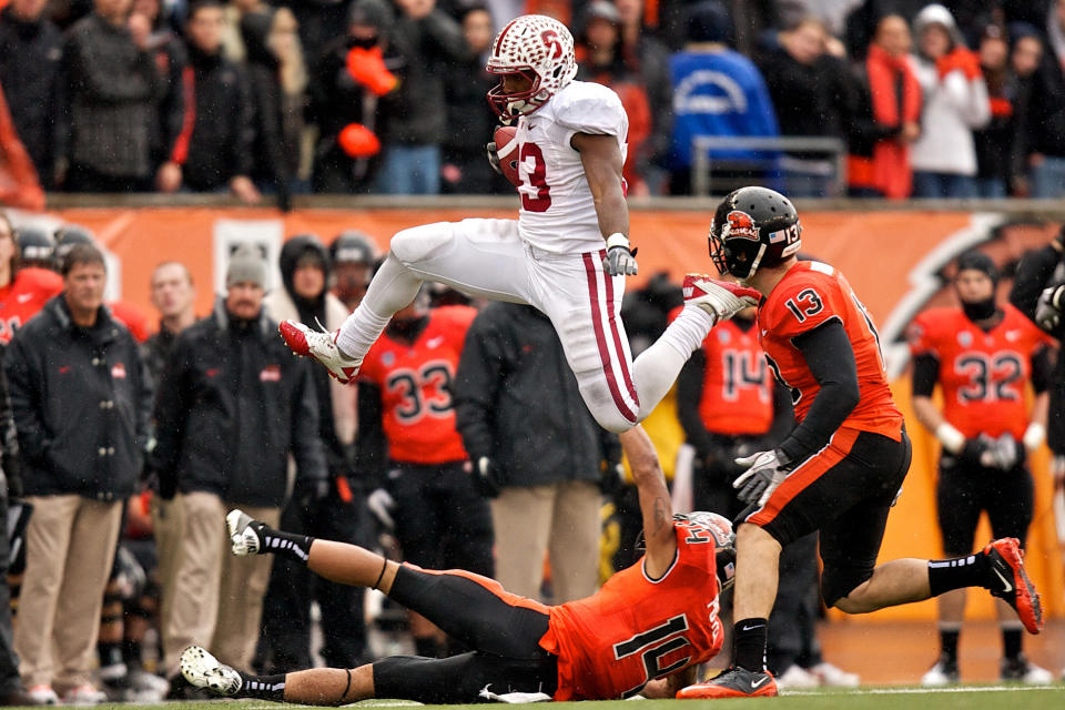 CORVALLIS, OR - NOVEMBER 5: Running back Stepfan Taylor #33 of the Stanford Cardinal leaps over cornerback Jordan Poyer #14 of the Oregon State Beavers in the third quarter on November 5, 2011 at Reser Stadium in Corvallis, Oregon. Stanford won the game 38-13. (Photo by Craig Mitchelldyer/Getty Images)