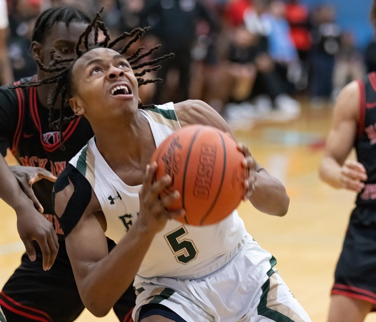 GlenOak’s Katour Ashcraft looks to the basket during a district semifinal against McKinley on Thursday, March 7, 2024.